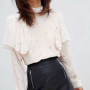 Religion high neck shirt with ruffle and tie back
